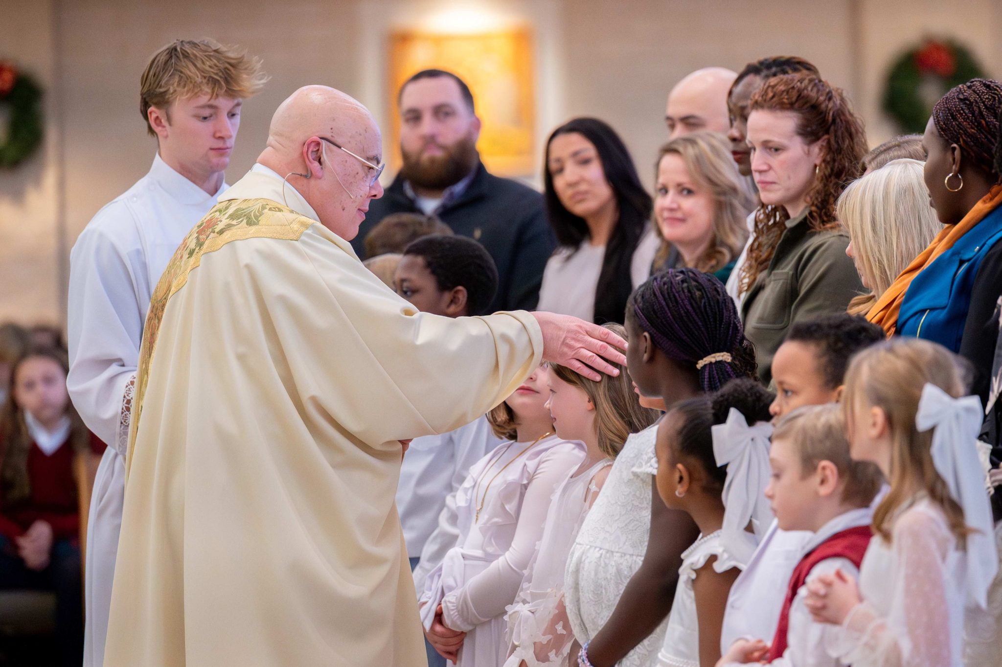 ‘Like an Easter Vigil:’ 13 Schoolmates Baptized Together in January Mass